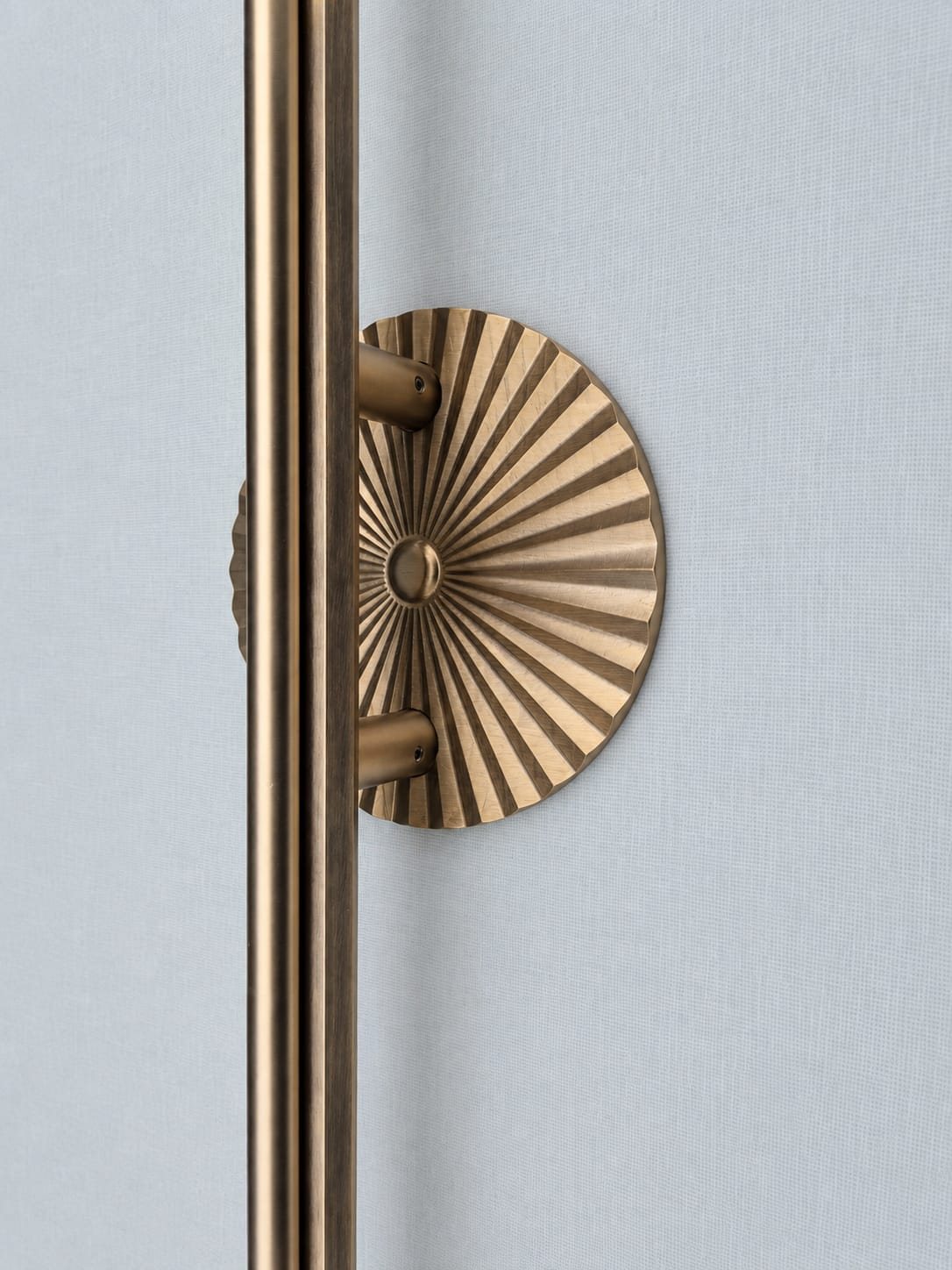 Hand-fluted sunburst brass rosette back plate with pull bar in antique brass finish, Kakal Brothers Solstice